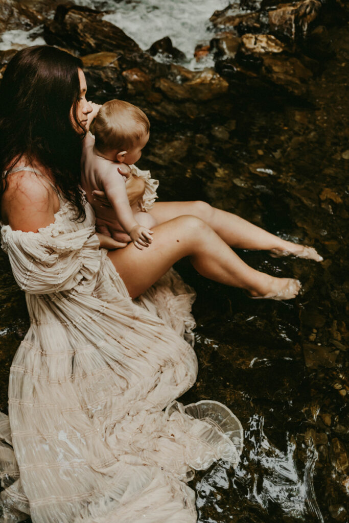 Family Photography, woman in white dress holding baby